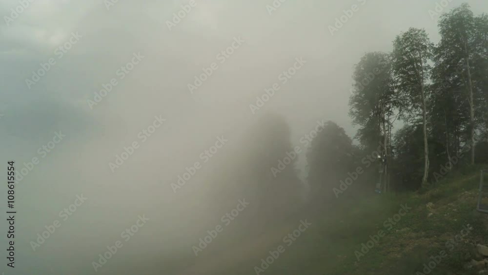 Lifts in mountains in summer fog Lifts in mountains in summer fog