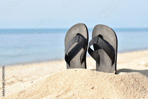 Summer vacation concept--Flipflops on a sandy ocean beach