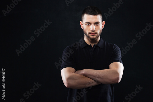 Handsome man with arms folded