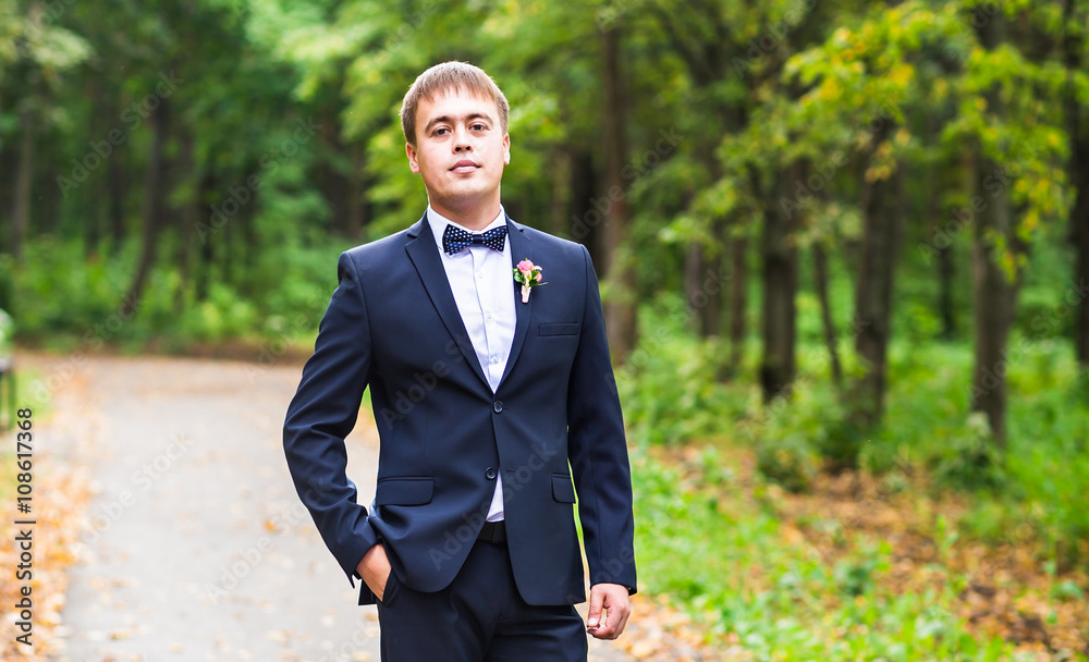 Sexy man in tuxedo and bow tie posing Sexy man in tuxedo and bow tie posing