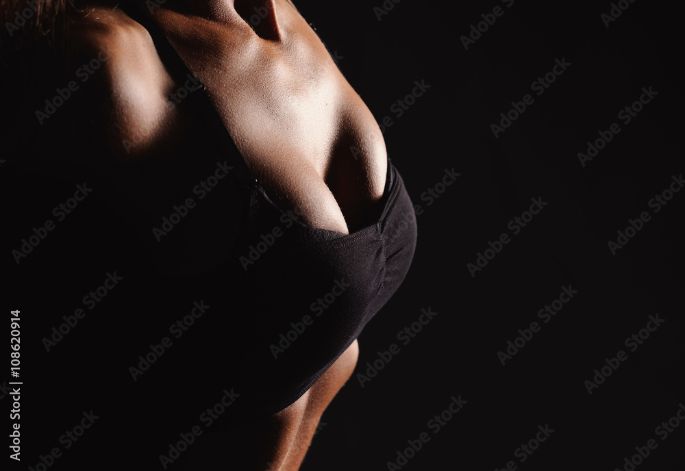Naklejka premium Beautiful female body on a dark background