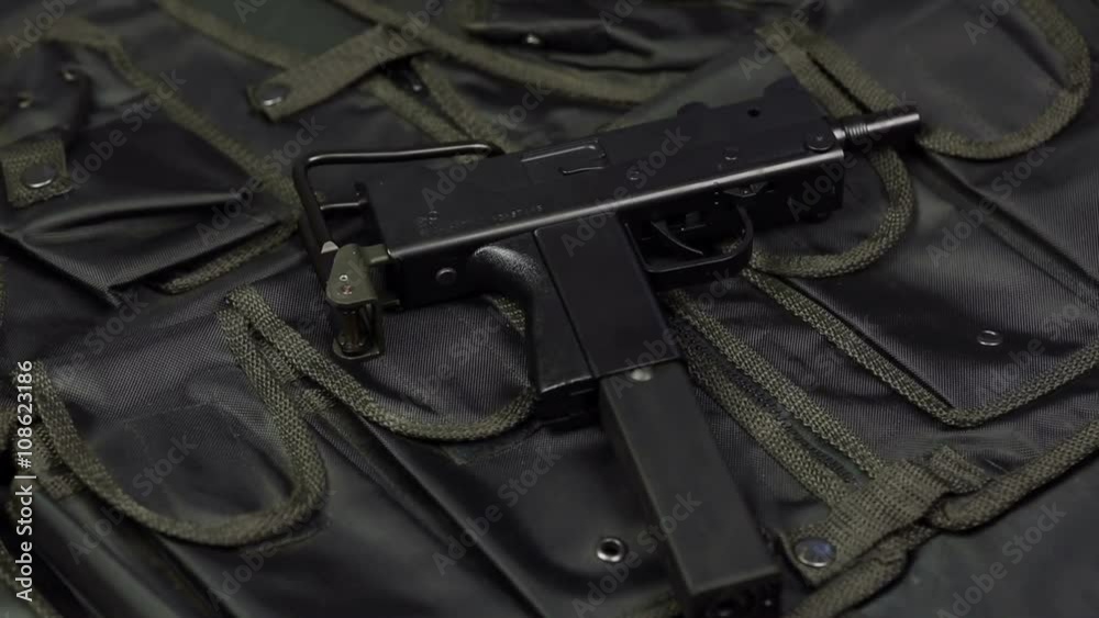 Submachine gun against the background of the vest Submachine gun against the background of the vest