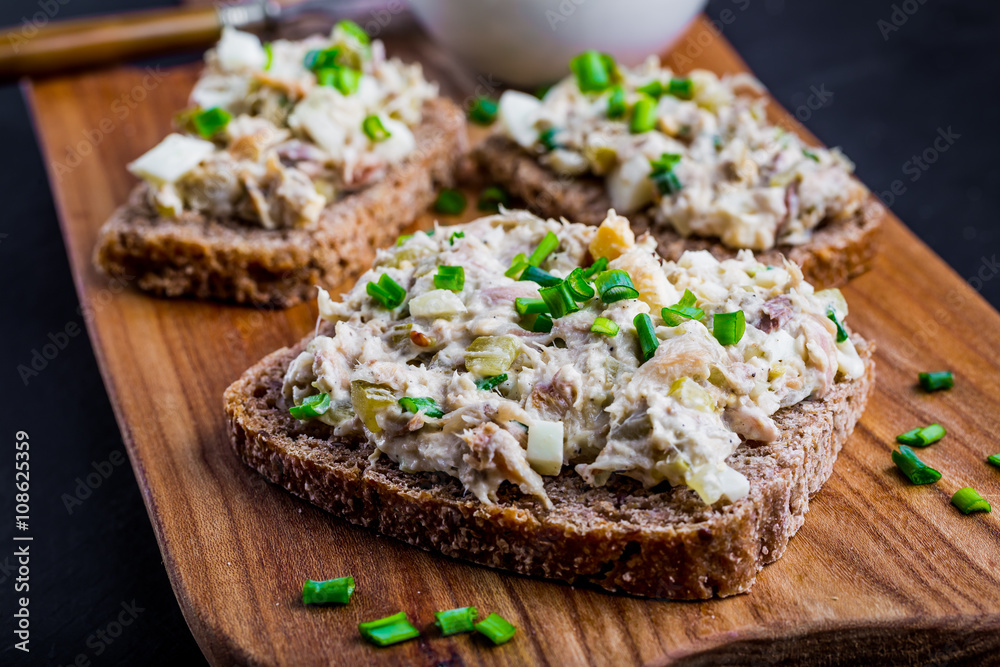 Sandwiches with a paste of smoked fish, cucumber, egg and mayonnaise Sandwiches with a paste of smoked fish, cucumber, egg and mayonnaise