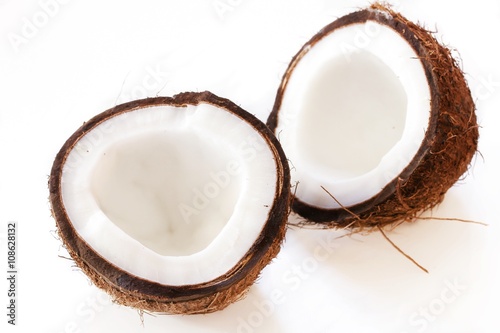 Coconut cut in half isolated on white