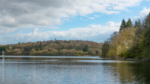 A landscape photograph of a resivior surrounded beautiful countryside located in Cornwall and Devon.