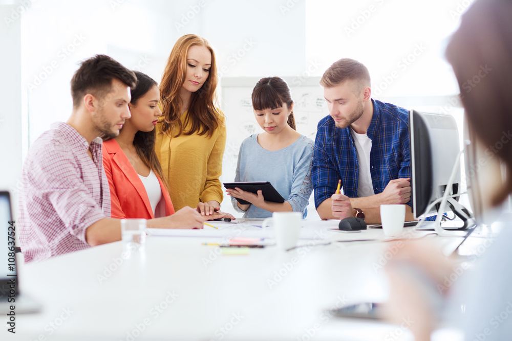 creative team with blueprint working at office creative team with blueprint working at office