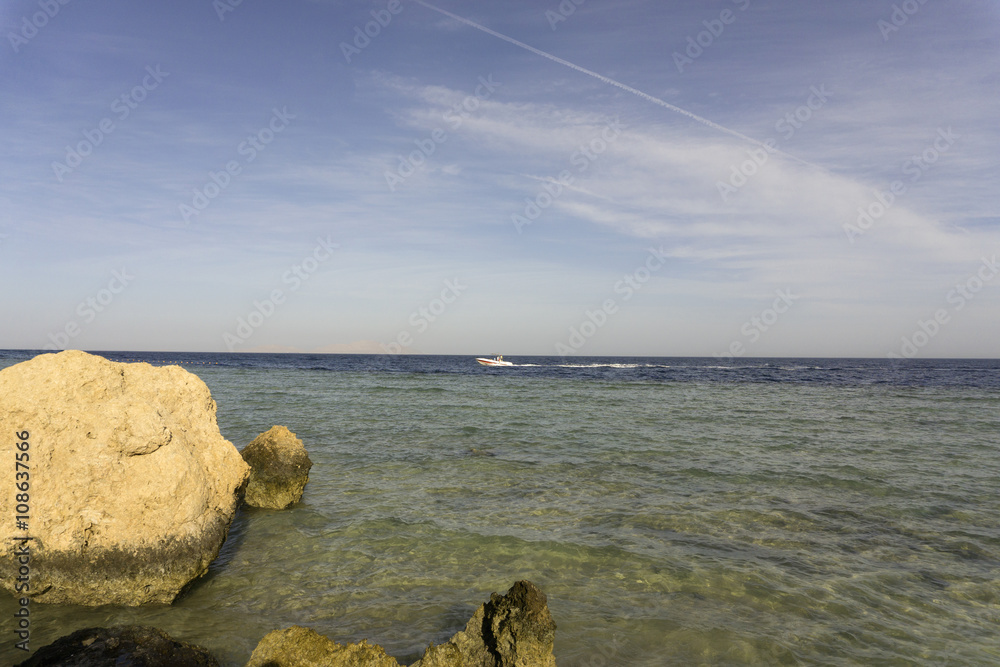 Sea and colorful clouds on a sky