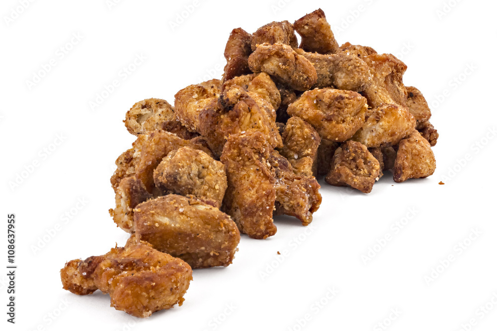 Heap of domestic salty fried pork greaves, cvarci, isolated on white Heap of domestic salty fried pork greaves, cvarci, isolated on white