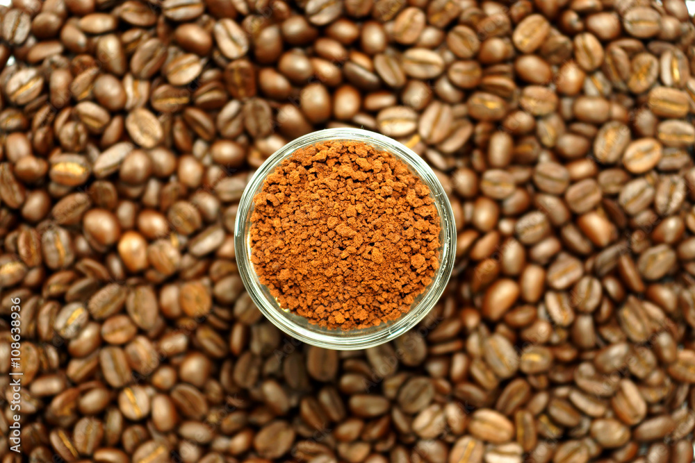 roasted coffee beans and coffee powder in the glass. roasted coffee beans and coffee powder in the glass.