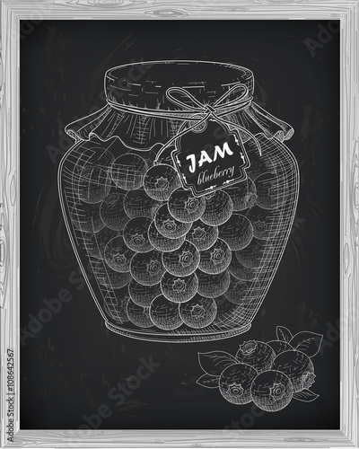 beautiful jar of homemade jam with blueberry on a black backgrou
