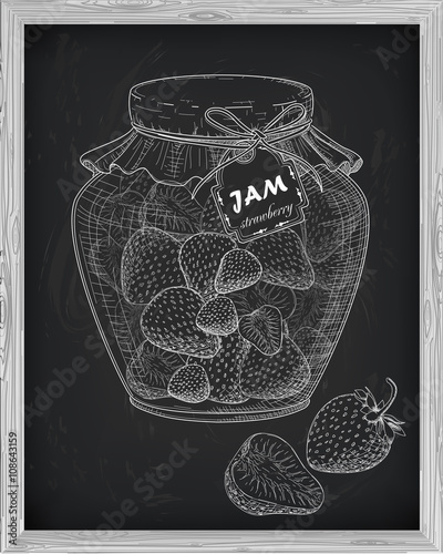 beautiful jar of homemade jam with strawberry on a black backgro