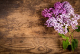 Lilac flowers on old wood table