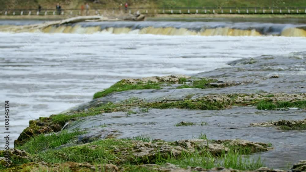 Close-up shot of spring flood waters on Europe's widest waterfall Venta rapids in Kuldiga, Latvia Close-up shot of spring flood waters on Europe's widest waterfall Venta rapids in Kuldiga, Latvia