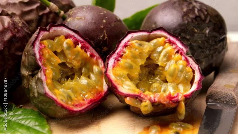 Passion fruits on wooden tray on wooden table background. Passion fruits on wooden tray on wooden table background.