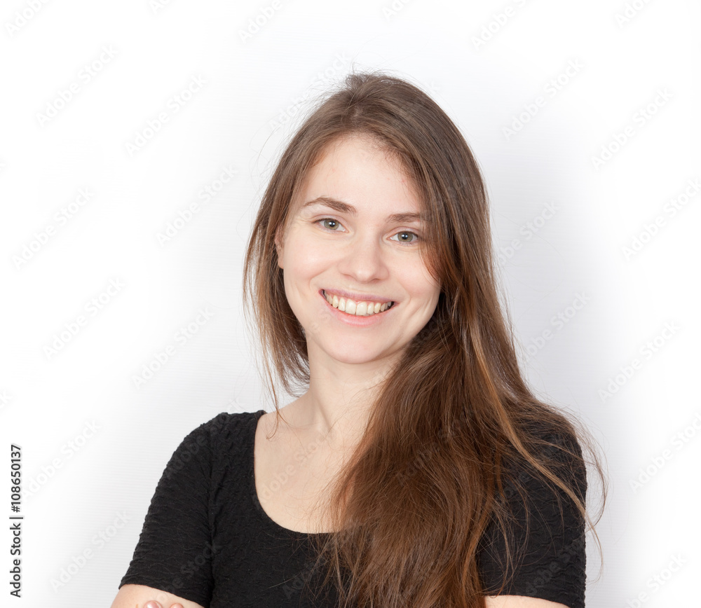 Brown-haired young woman smiles