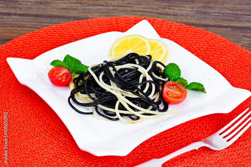 Black Spaghetti with Cuttlefish Ink, Tomato and Basil. Mediterra photo