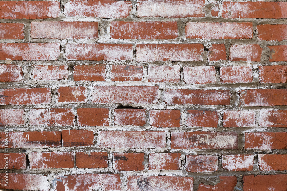 red brick wall with cracks covered with white paint red brick wall with cracks covered with white paint