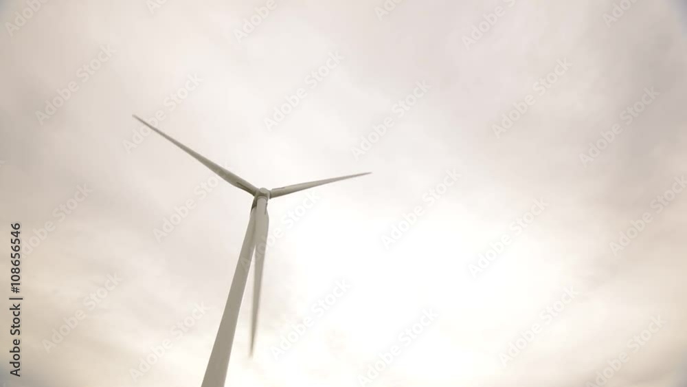 Engineer Inspecting Wind Turbine Engineer Inspecting Wind Turbine