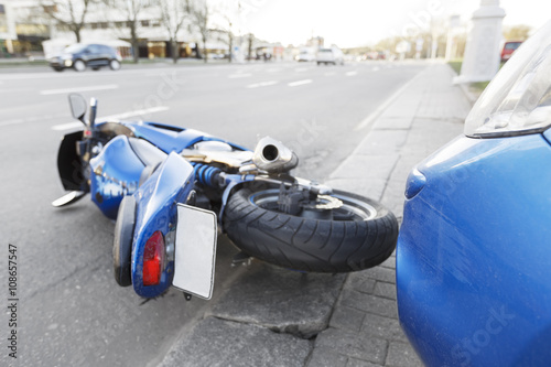 Accident motorcycle and cars on  road