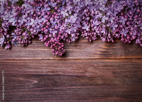 lilac flowers on an old wooden board