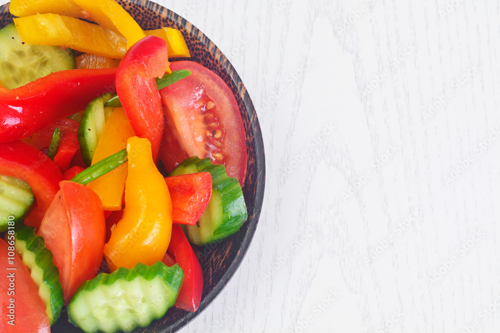 Healthy and diet food: Lettuce, tomato, pepper, seeds, oil, salt Healthy and diet food: Lettuce, tomato, pepper, seeds, oil, salt