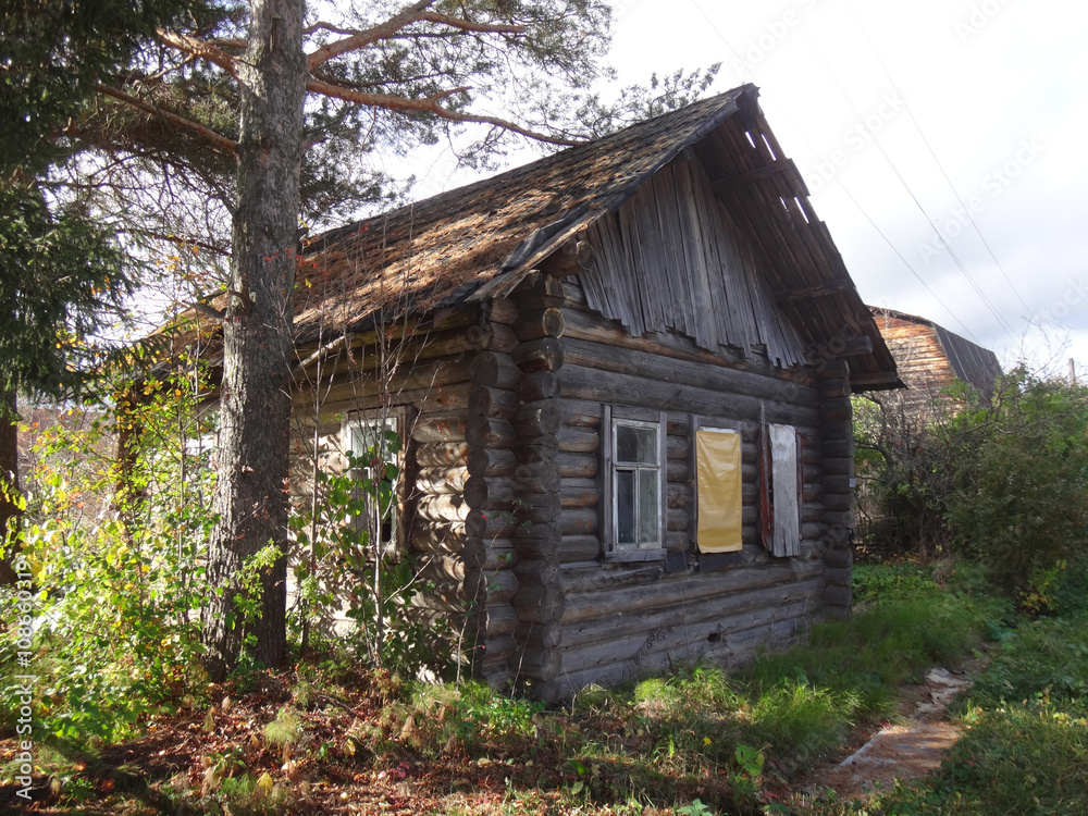 House in a village in a autumn day House in a village in a autumn day