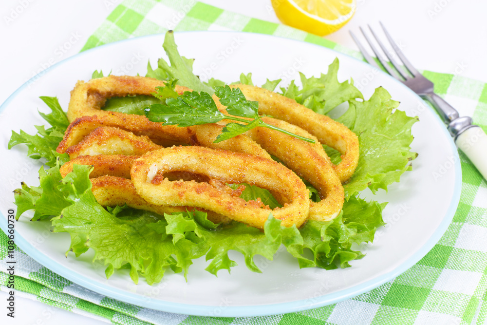 Fried Squid Rings in Breadcrumbs with Lettuce and Lemon
