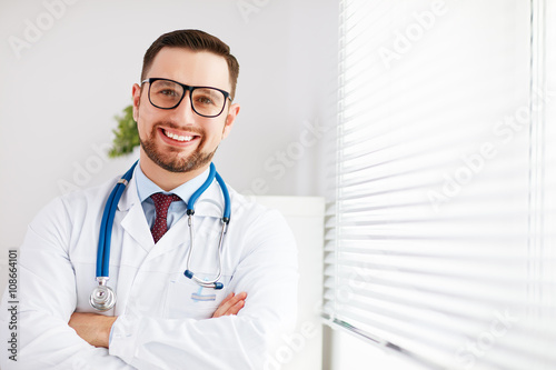 friendly male doctor in his office