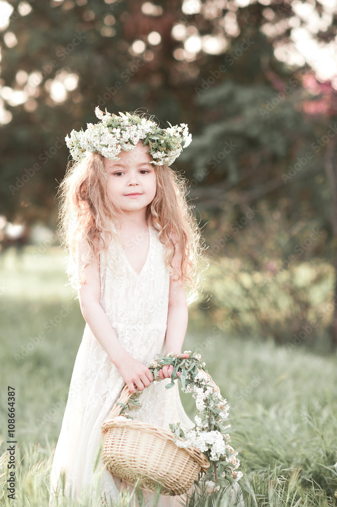 Cute kid girl 3-4 year old wearing stylish white dress and floral