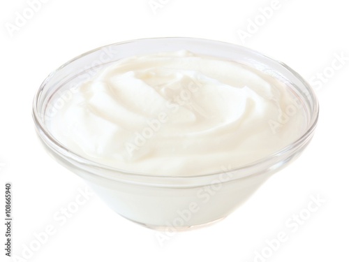 Greek yogurt in a transparent bowl isolated on a white background