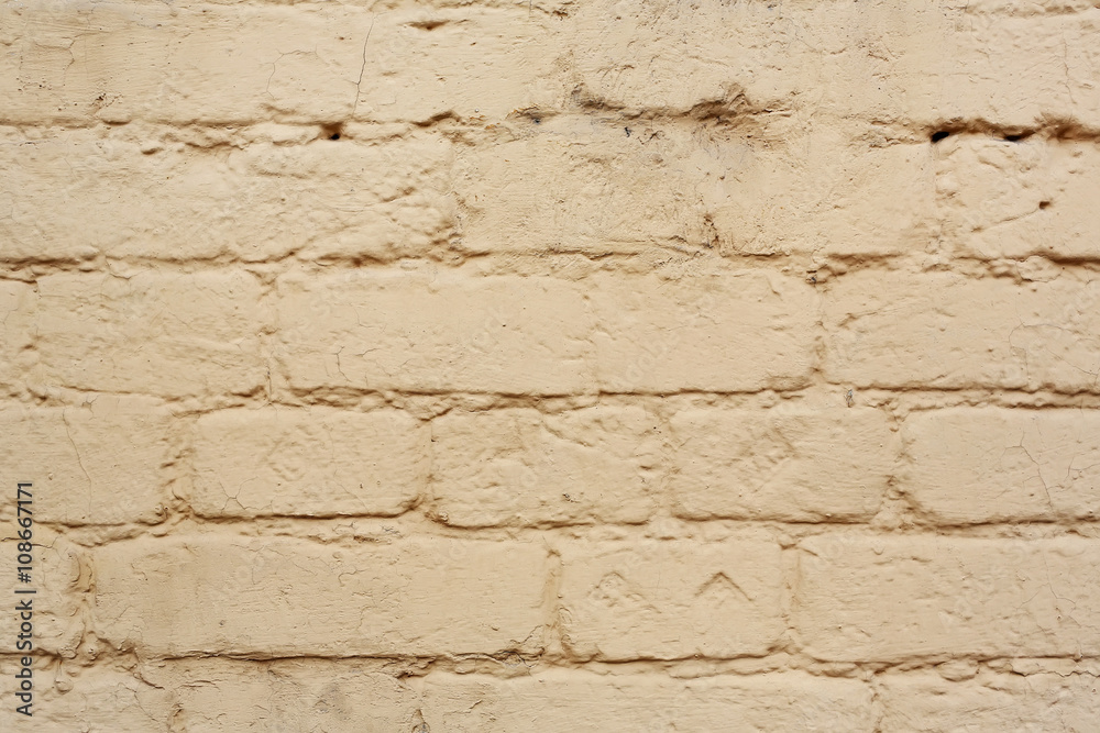 Brick wall. The brick wall painted in yellow Brick wall. The brick wall painted in yellow