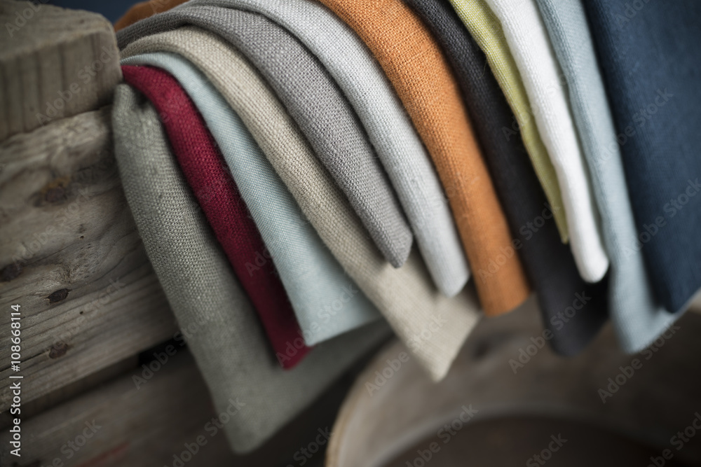 Layers of Folded Color Linen Hanging on Crate Stock Photo | Adobe Stock