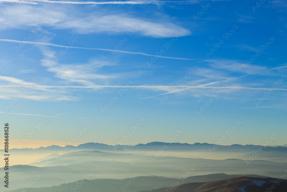 Obraz premium Mountains top on blue sky