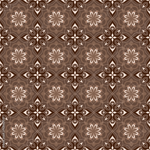 Filigree golden texture on a brown background.