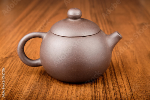 Chinese teapot on woden desk