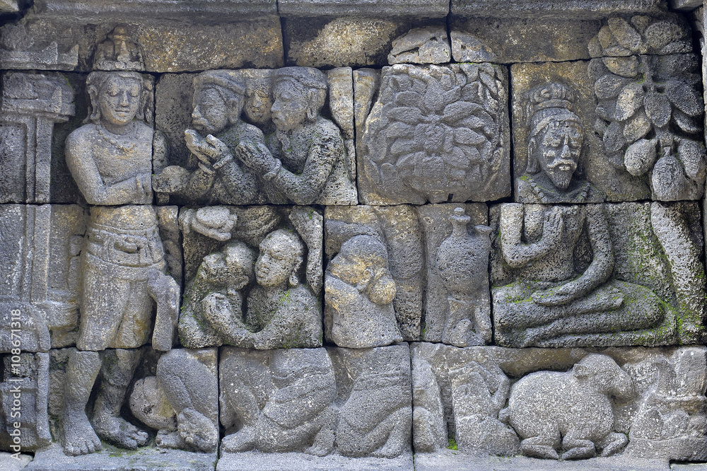 Detail of Buddhist carved relief in Borobudur temple