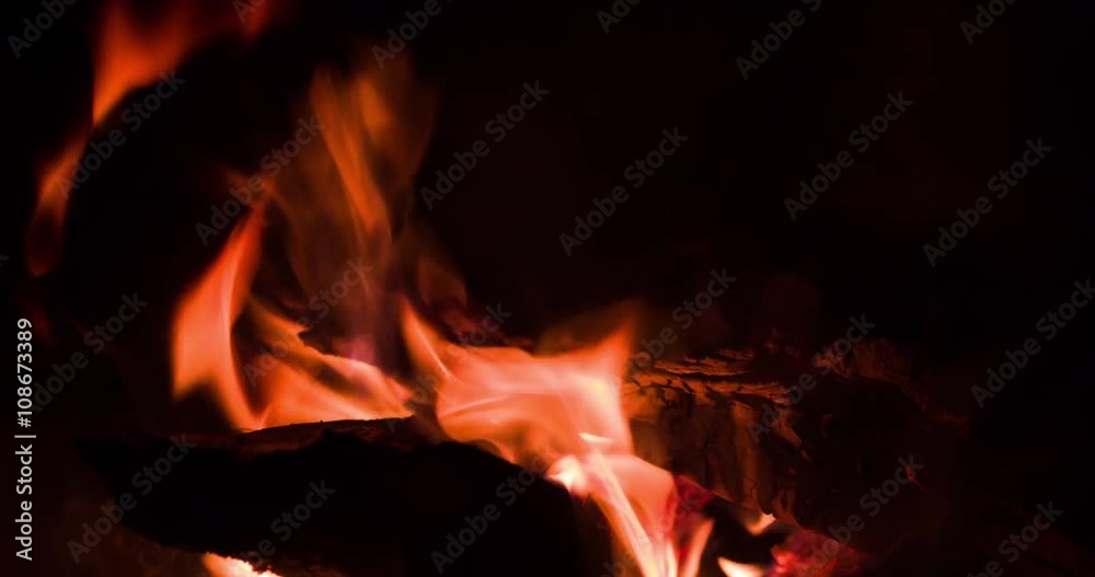 Flames of fire pit flickering in darkness of winters evening. Flames of fire pit flickering in darkness of winters evening.