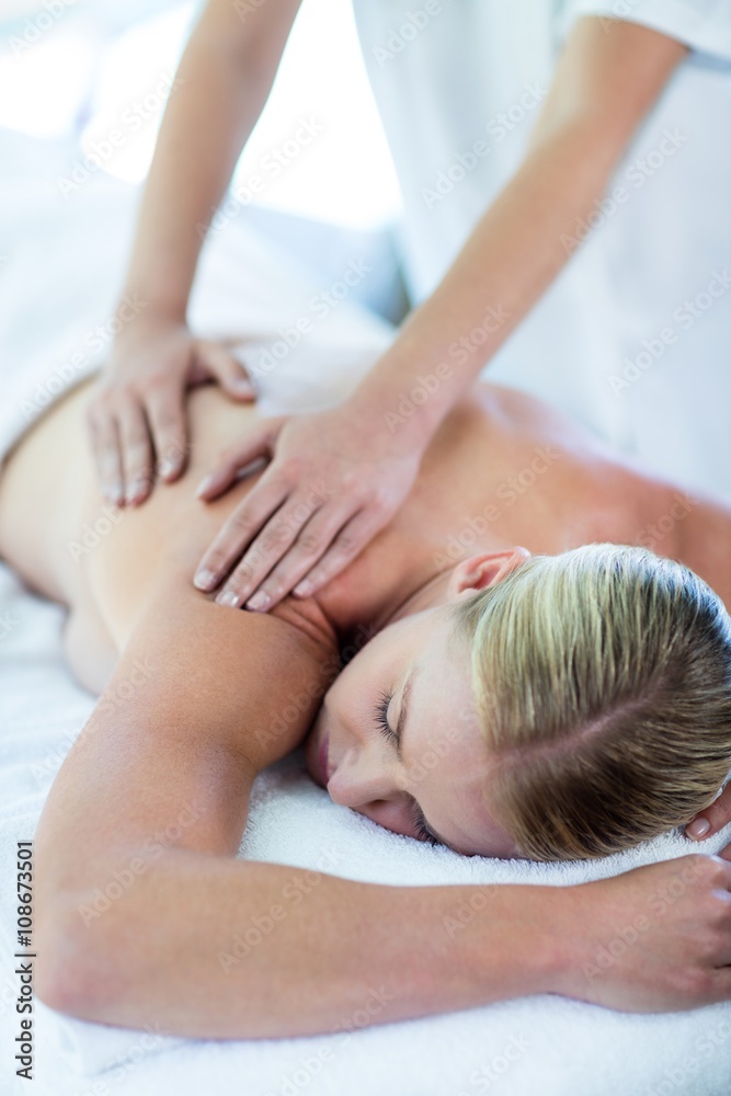 Woman receiving a back massage Woman receiving a back massage