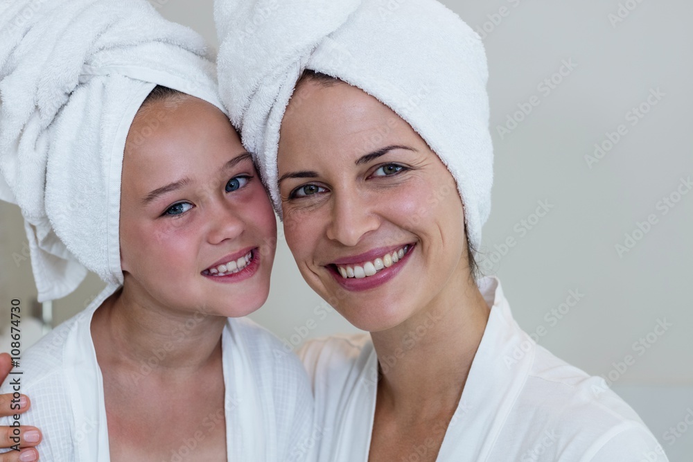 Portrait of mother and daughter in bathrobe Portrait of mother and daughter in bathrobe