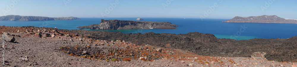 View of Palea Kameni island and Santorini from Nea Kameni, Greece.