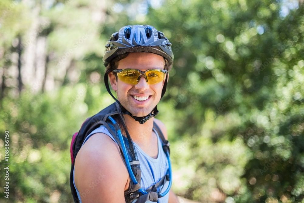 Portrait of smiling man wearing helmet at forest Portrait of smiling man wearing helmet at forest