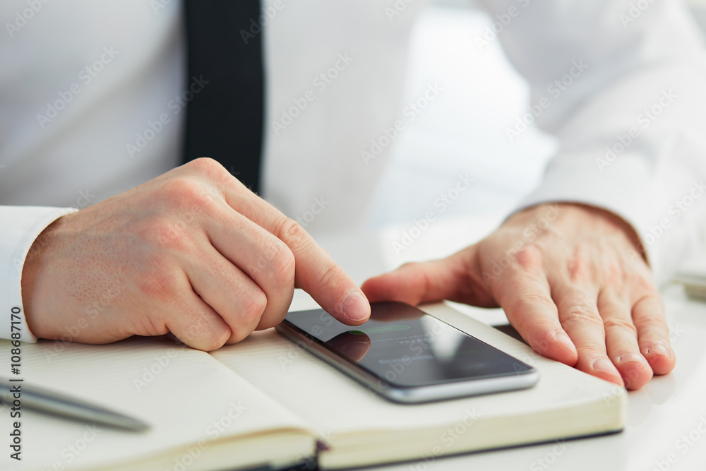 Man trying to log into mobile banking Man trying to log into mobile banking