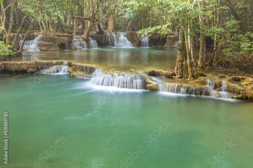 tropical waterfall in deep forest of Kanchanaburi province, Thailand.