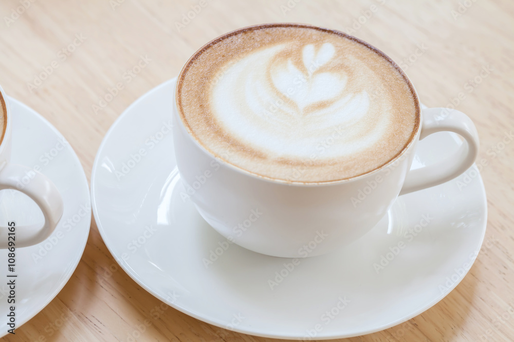 Latte Coffee art on the wooden table Latte Coffee art on the wooden table