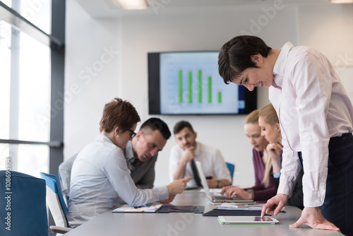 young woman using tablet on business meeting