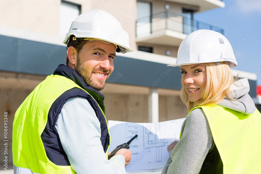 Worker and enginner checking last details before delivery Worker and enginner checking last details before delivery