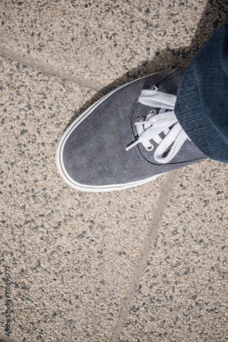 Canvas shoes walking on concrete