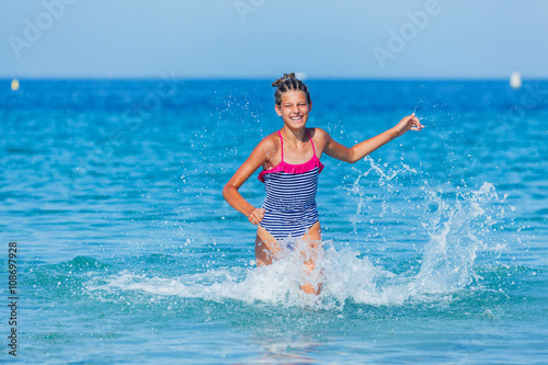 Girl running through the water