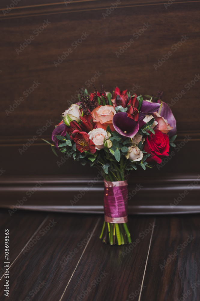 Bouquet of flowers on the floor against the wall 5929. Bouquet of flowers on the floor against the wall 5929.