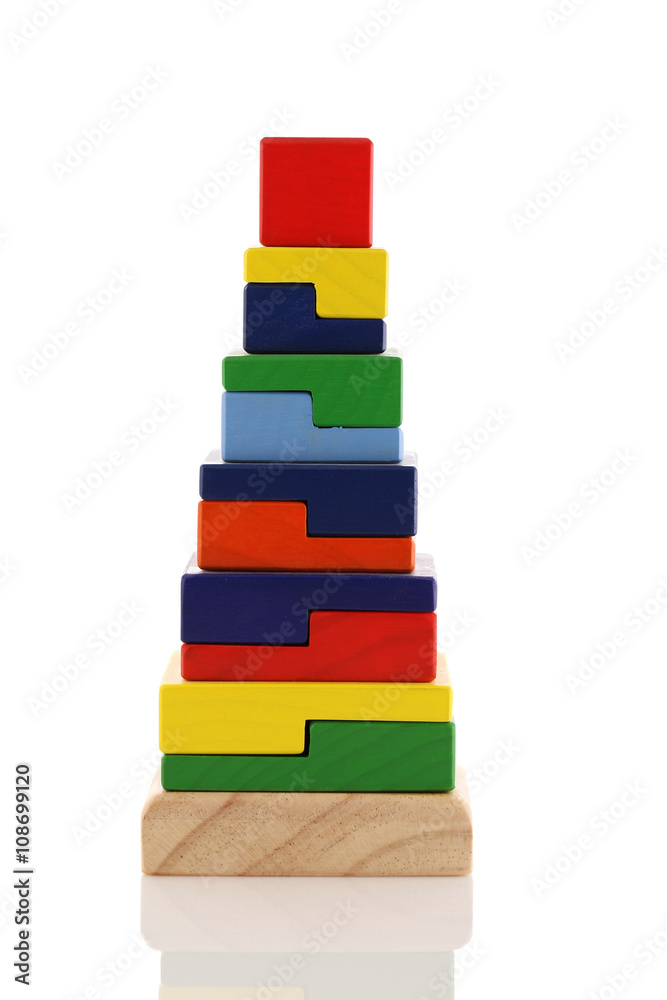 Obraz premium wooden pyramid children's toy isolated on white background.